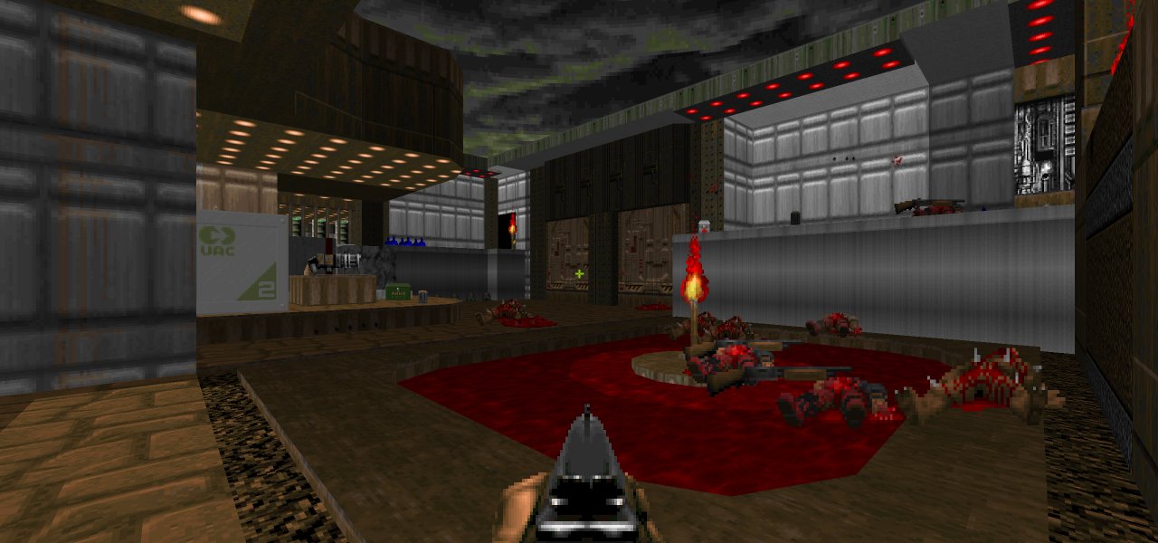 Outdoor area with overhead lighting. A small pool of blood is lit by a torch. A large pair of doors are visible on the opposite end of the room.